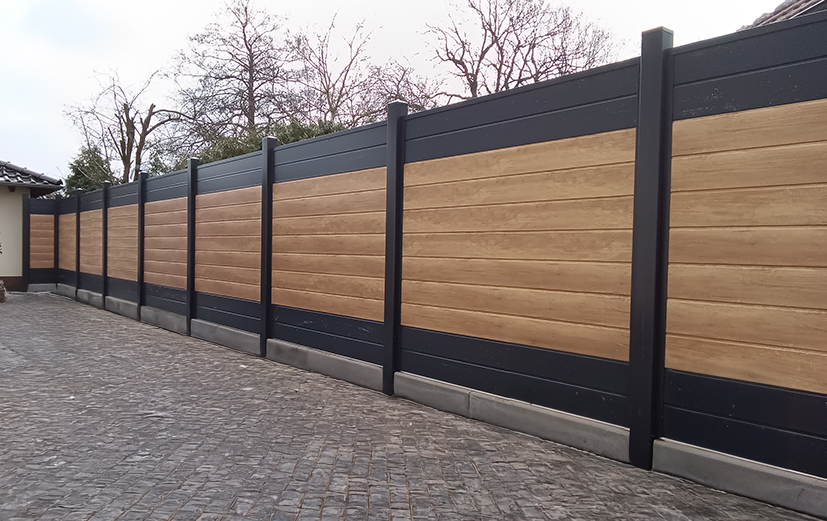 Stilvolle Einfriedung entlang der Einfahrt